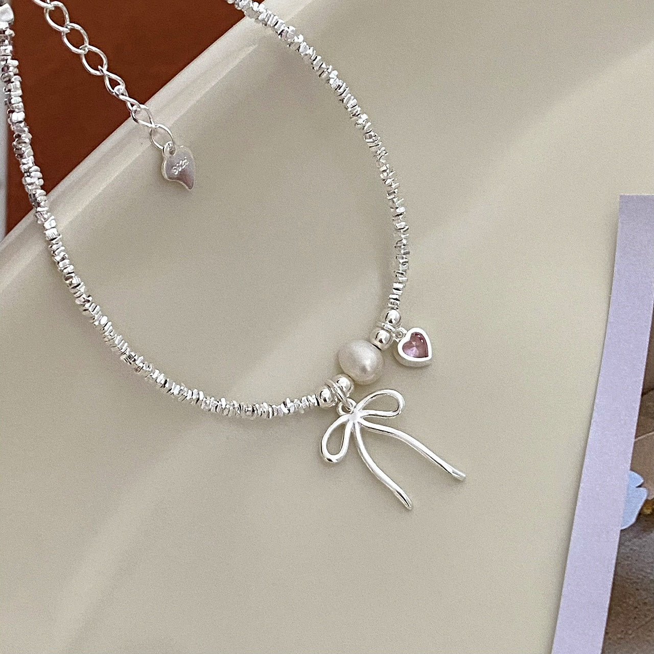 Sterling Silver Bow And Pink Heart Bracelets