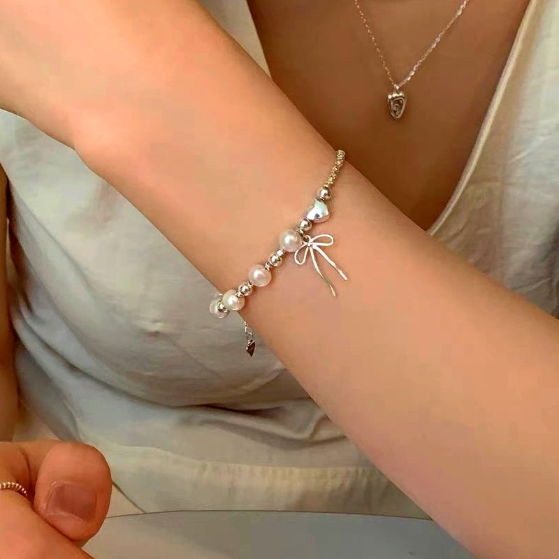 Sterling Silver Pearl And Bow Bracelets