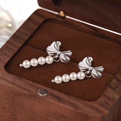 Sterling Silver Elegant Bow And Pearl Earrings