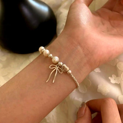 Sterling Silver Pearl And Bow Bracelets